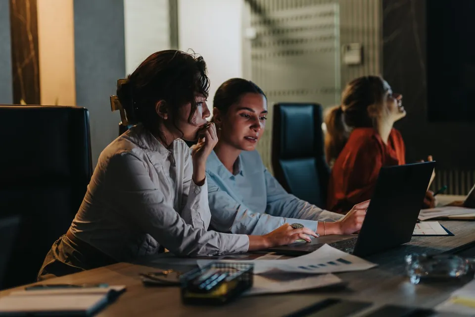 Engineers working together at a desk